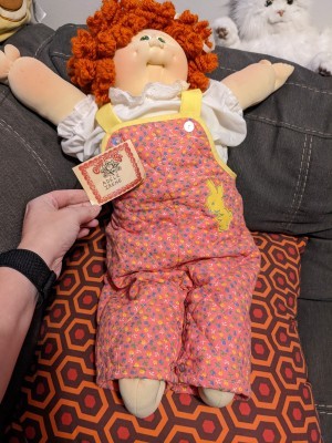 A Cabbage Patch doll with red hair.