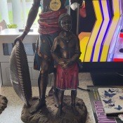 An African sculpture of a warrior and a young boy.