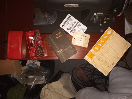 A collection of materials included with a White sewing machine.