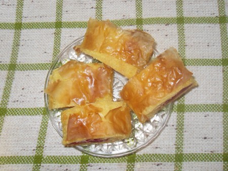 A plate of rolled cherry pie pieces.