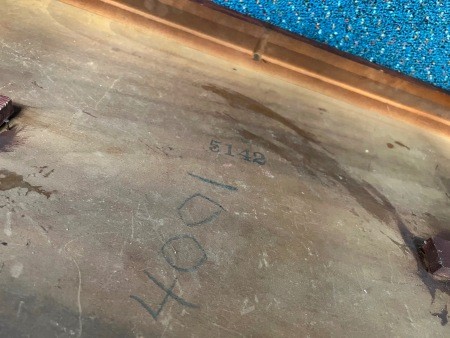 The markings on the back of a table.