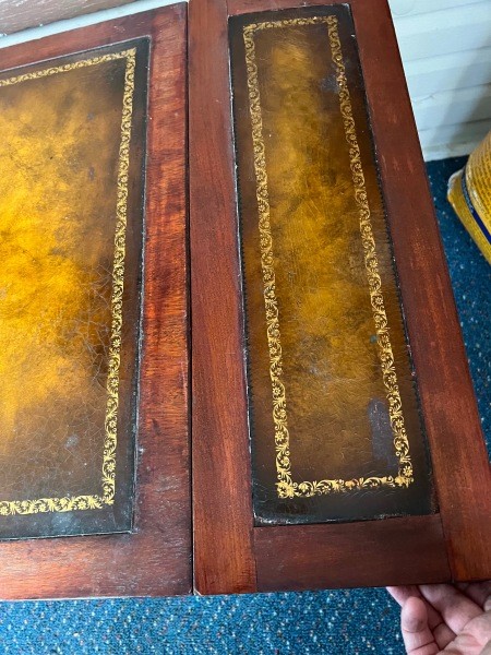 The drop leaf on a table.