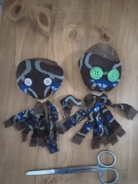 Cutting the sock ends to resemble octopus tentacles.