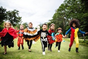 A group of kids in costume on Halloween.