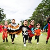 A group of kids in costume on Halloween.