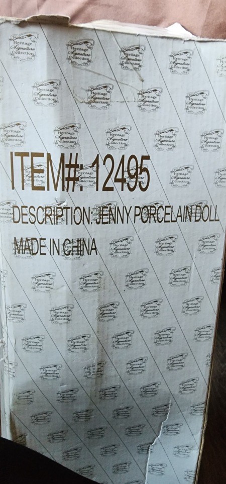 The packaging for a porcelain doll.