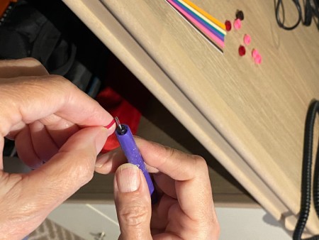 Attaching paper to quilling tool.
