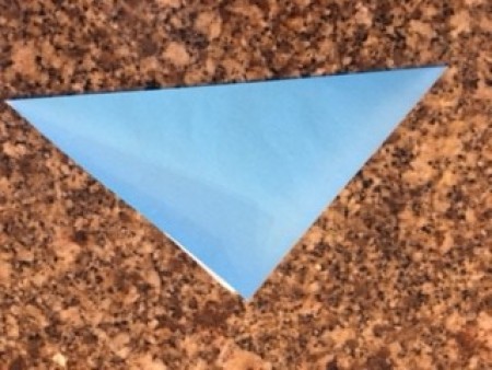 A piece of origami paper folded in half.