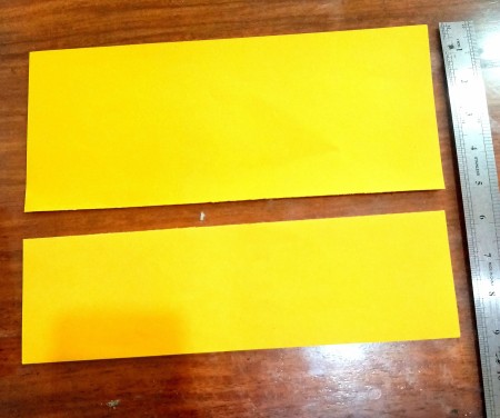 Cutting a strip of paper.