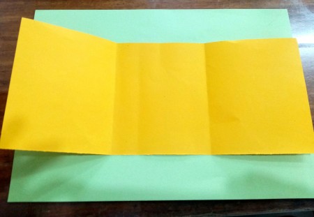 Folding the paper into thirds.