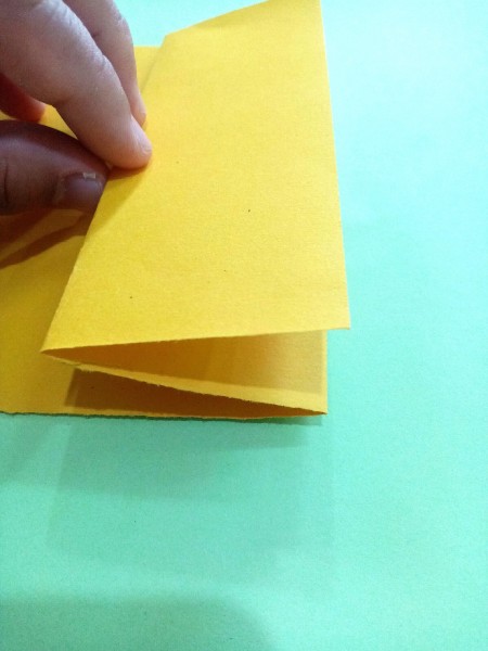 Folding the paper.
