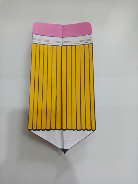 Folding the pencil closed.