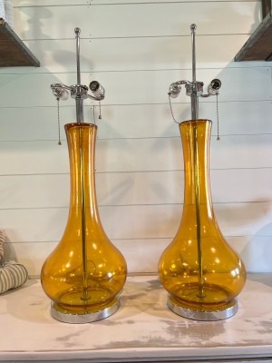 Two amber colored glass lamps.