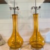 Two amber colored glass lamps.