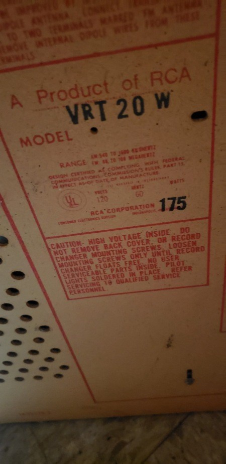 Markings on the back of a console stereo.