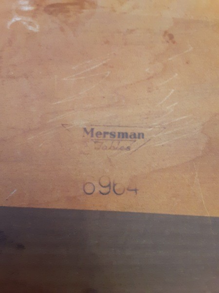 The marking on the underside of the table.
