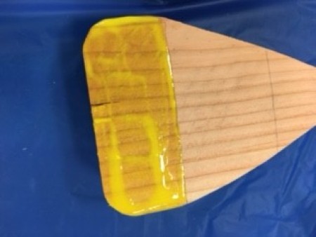 Painting the lower section yellow.