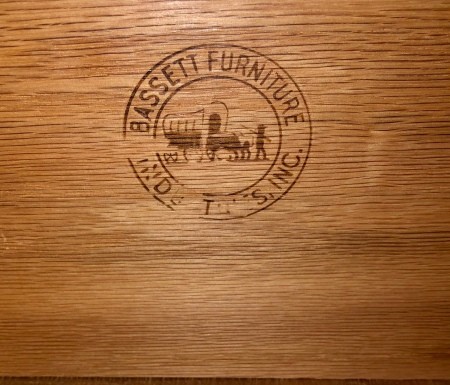 The Bassett marking on a piece of furniture.