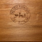 The Bassett marking on a piece of furniture.