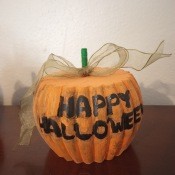 A pumpkin made from a round chair leg.