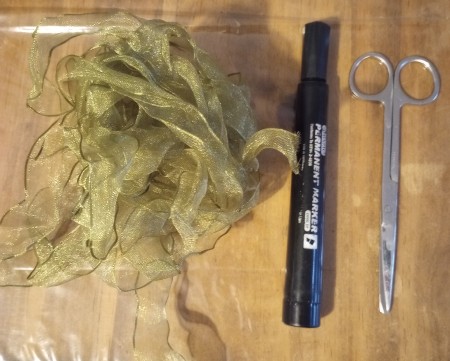 Ribbon and markers for decorating pumpkins.