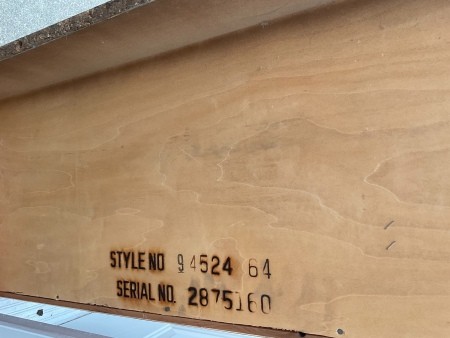 Markings on the back of the cedar chest.