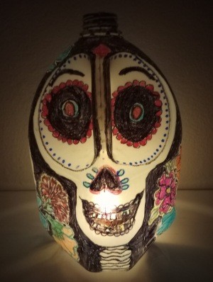 A painted milk jug to resemble a sugar skull.