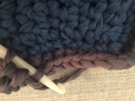 Crocheting the basket with a different color.