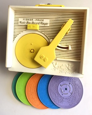 A Fisher Price record player with 5 records.