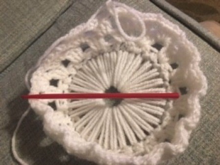 Crocheting the basket from the CD base.