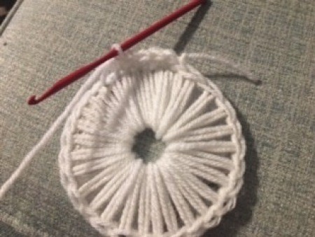 Crocheting the basket from the CD base.