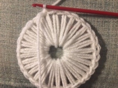 Crocheting the basket from the CD base.