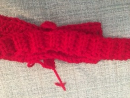 Continuing to crochet the bow end.