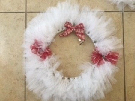 The wreath with bows attached.