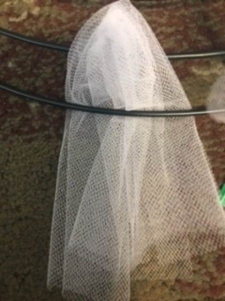 Attaching the tulle to the wreath form.