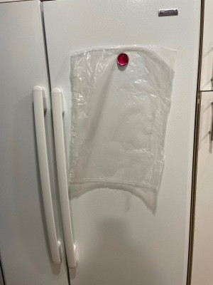 A cereal liner on a refrigerator door.