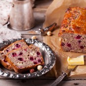 Cranberry nut bread loaf, with 2 slices cut.