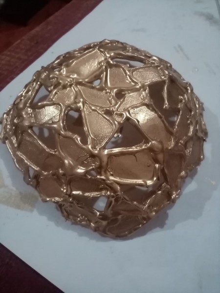 Painting the underside of the cardstock gold.