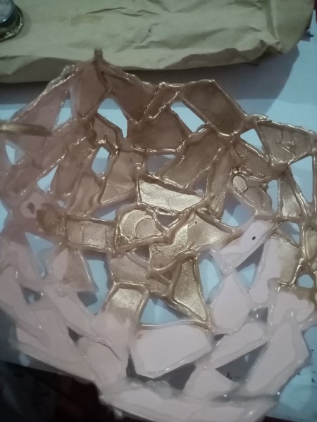 Painting the cardstock form gold.