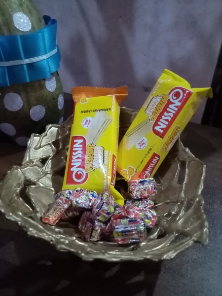 The completed cardstock bowl with candy inside.