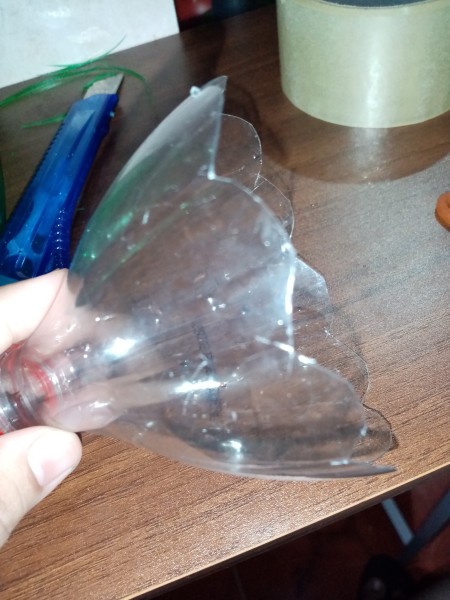 The top of the plastic bottle, cut in a petal shape.