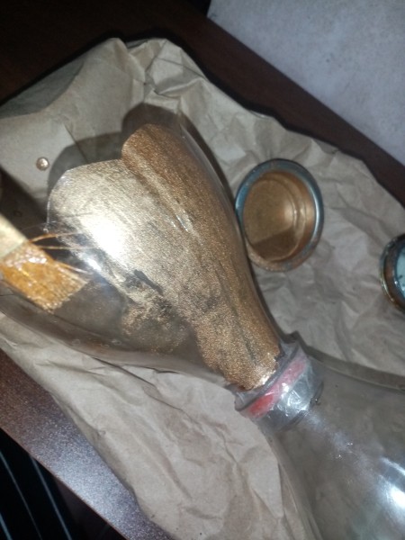 Painting the top plastic gold.