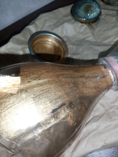 Painting the plastic gold.