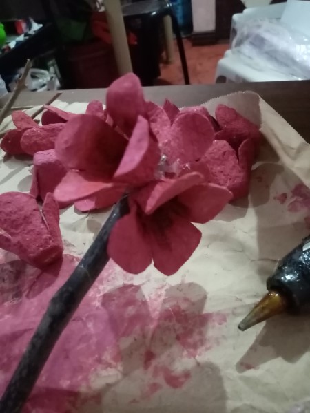 Attaching the flowers to a stem.