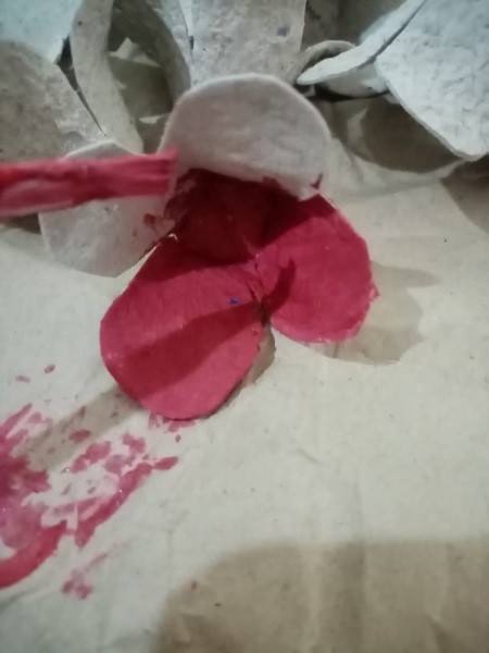 Painting the egg carton flower.