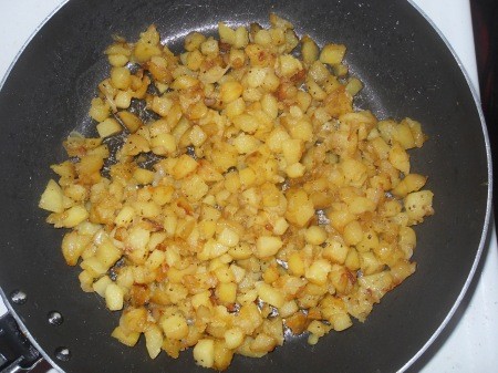 Frying potatoes in a pan.