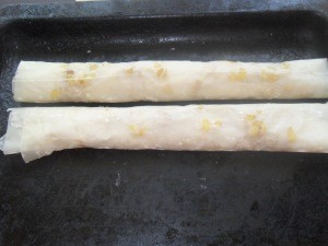 The rolled up sheets of potato and pastry.