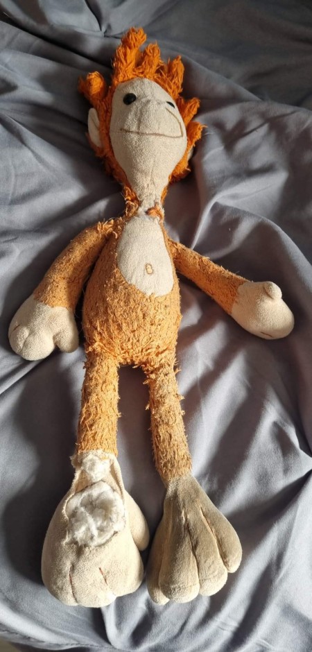 An old stuffed monkey toy.