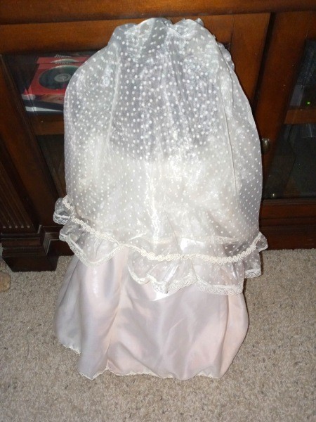 The back of a bridal doll.