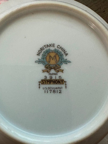 The marking on the back of a set of china.